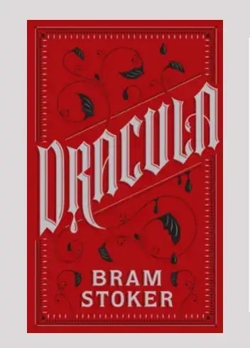 Red book cover of 'Dracula' by Bram Stoker with decorative elements.